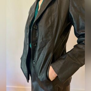 100% leather blazer. Excellent condition, structured fit.